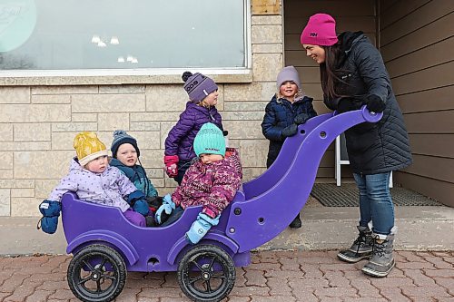 24032022
Kayla Graham walks with kids from her childcare program in Minnedosa, Manitoba on Thursday. (Tim Smith/The Brandon Sun)