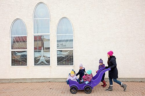 24032022
Kayla Graham walks with kids from her childcare program in Minnedosa, Manitoba on Thursday. (Tim Smith/The Brandon Sun)