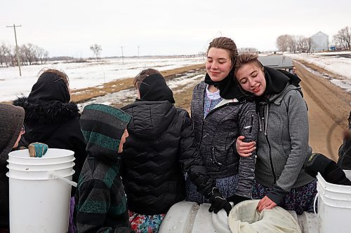24032022
Children from Deerboine Hutterite Colony collect maple sap from maple trees on the colony Thursday for the first time this year to make maple syrup for use on the colony. For the sap to run the temperature must be cold overnight and warm during the day. (Tim Smith/The Brandon Sun)