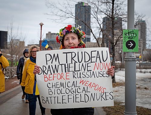 JESSICA LEE / WINNIPEG FREE PRESS

Olga Safroshkina holds a sign near the Human Rights Museum on March 24, 2022 during a protest which called for an end to the Russian invasion of Ukraine.


