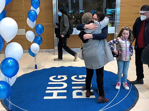 CODY SELLAR / WINNIPEG FREE PRESS        

Debbie MacPhee (grey coat) embraces her daughter for the first time in four years. 

Hug Rug