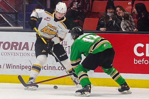 Brandon Wheat King Riley Ginnell takes on Prince Albert Raider Landon Kosior in a Western Hockey League game Friday at Westoba Place. (Chelsea Kemp/The Brandon Sun)