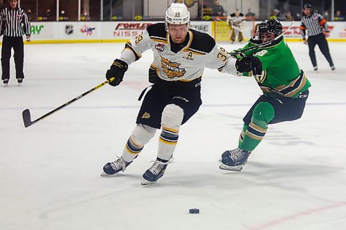 Brandon Wheat Kings Chad Nychuk defends against Prince Albert Raiders Zachary Wilson in a Western Hockey League game Friday at Westoba Place. (Chelsea Kemp/The Brandon Sun)