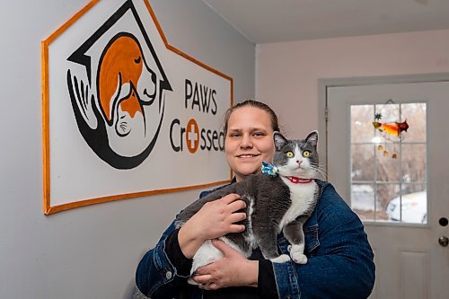 Paws Crossed Animal Shelter volunteer co-ordinator and service cat program lead Brittany Bergwall holds service cat in training Bean Thursday. (Chelsea Kemp/The Brandon Sun)