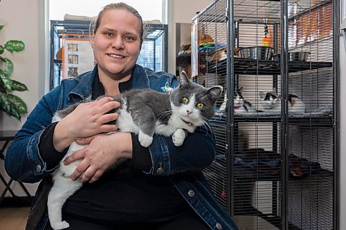 Paws Crossed Animal Shelter volunteer co-ordinator and service cat program lead Brittany Bergwall holds service cat in training Bean Thursday. (Chelsea Kemp/The Brandon Sun)