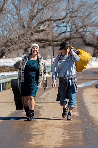 Deb and Tim Shewchuk walk through Victoria Park in Souris on Wednesday, March 23, 2022. The duo were exploring the park looking for the perfect spot to test out the acoustics of the instruments. They originally hail from The Pas. (Chelsea Kemp/The Brandon Sun)