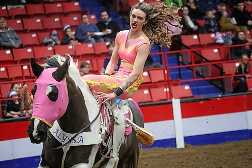 Braillyn Giroux, a trick rider with Tom Bishop's Wild West Show, gets ready to perform in the main arena during the opening day of the Royal Manitoba Winter Fair on Monday afternoon. (Matt Goerzen/The Brandon Sun)