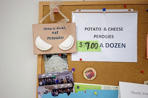 MIKE DEAL / WINNIPEG FREE PRESS
A sign says, &quot;When in doubt, eat perogies!&quot; on the bulletin board in the church basement.
Holy Eucharist operates a year-round Perogy Hotline to raise funds for the church. Amid the crisis in Ukraine, the volunteers have started donating a portion of their proceeds to humanitarian efforts in the country.
see Eva Wasney story
220324 - Thursday, March 24, 2022.