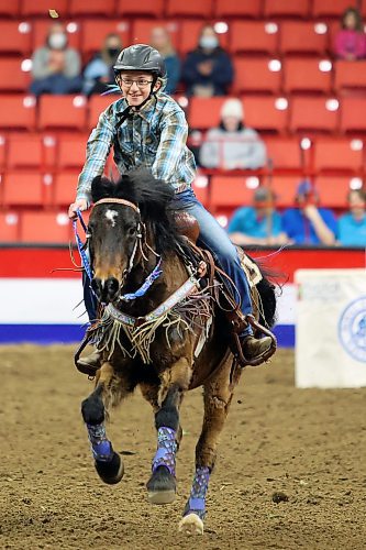 29032022
Adi McKenzie competes in the barrel racing event at the Royal Manitoba Winter Fair on Tuesday evening.
(Tim Smith/The Brandon Sun)