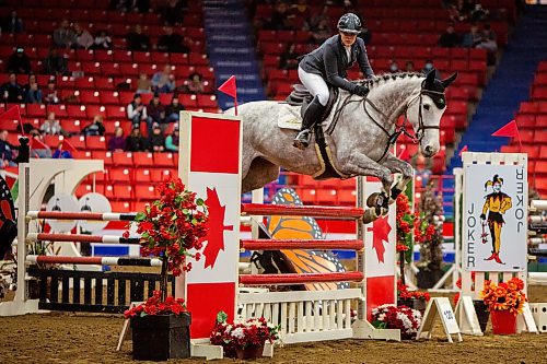 Femke Courchaine competes with Lemonade BF in the Gamblers Choice Hunter Jumper competition during the First Night of the Royal Manitoba Winter Fair Monday. (Chelsea Kemp/The Brandon Sun)