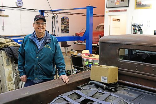 Carman Tufts poses for a photo in his personal garage in Souris on Thursday morning. Tufts told the Sun that he is going to be spending a lot of time in this space after officially retiring later this summer. (Kyle Darbyson/The Brandon Sun)