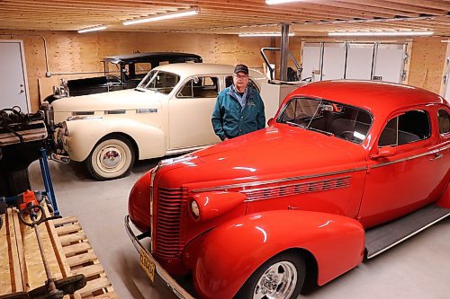 Carman Tufts stands next to his 1930 Ford Model A, 1940 LaSalle and 1938 Buick Coupe on Thursday morning. Tufts built an addition to his garage this past winter to properly store his classic car collection. (Kyle Darbyson/The Brandon Sun)