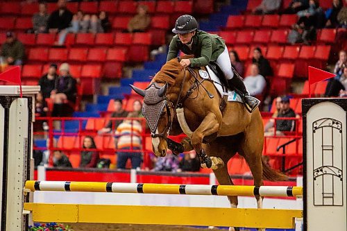 Jaydan Stettner competes with Ielinea JTL in the Gamblers Choice Hunter Jumper competition during the First Night of the Royal Manitoba Winter Fair Monday. (Chelsea Kemp/The Brandon Sun)