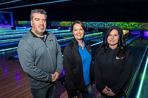 Big Brothers Big Sisters of Westman president Mike Sanderson, left, mentor and board secretary Kirby Sararas and executive director Paula Kotyk poses for a photo at T-Birds Thursday. (Chelsea Kemp/The Brandon Sun)