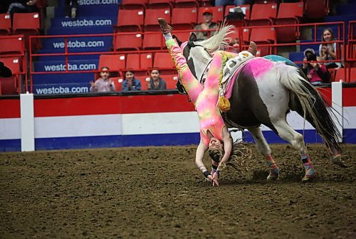 Braillyn Giroux, a trick rider with Tom Bishop&#x2019;s Wild West Show, gets ready to perform in the main arena during the opening day of the Royal Manitoba Winter Fair on Monday afternoon. (Matt Goerzen/The Brandon Sun)