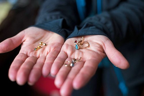 MIKAELA MACKENZIE / WINNIPEG FREE PRESS

Ukrainian refugee Tetiana Maksymtsiv shows the jewelry she brought with her when fleeing, which include pieces given to her by her husband and her mom, in Warsaw on Thursday, March 31, 2022.  For Melissa story.
Winnipeg Free Press 2022.