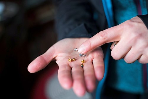 MIKAELA MACKENZIE / WINNIPEG FREE PRESS

Ukrainian refugee Tetiana Maksymtsiv shows the jewelry she brought with her when fleeing, which include pieces given to her by her husband and her mom, in Warsaw on Thursday, March 31, 2022.  For Melissa story.
Winnipeg Free Press 2022.