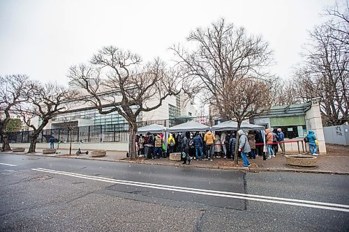 MIKAELA MACKENZIE / WINNIPEG FREE PRESS

Ukrainian refugees line up outside of the Canadian Embassy in Warsaw on Friday, April 1, 2022.  Most are waiting to get their biometrics done, which has been a sticking point to getting visas processed for many. For Melissa story.
Winnipeg Free Press 2022.