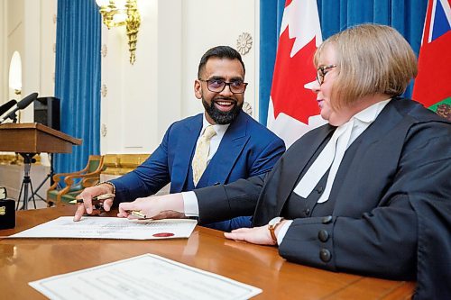 MIKE DEAL / WINNIPEG FREE PRESS
Obby Khan is sworn in by Patricia Chaychuk, clerk of the Legislative Assembly of Manitoba, as the newest MLA for the Manitoba PC Party, Monday morning at the Manitoba Legislative building. Having won the by-election for the Fort Whyte constituency he is the first Muslim elected to Manitoba's Assembly. 
220404 - Monday, April 04, 2022.