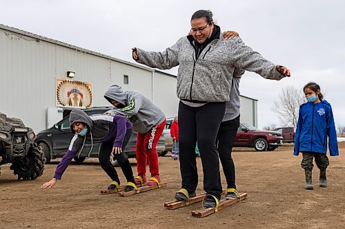 Dakota Amazing Race teams try their feet at sloshing during the Wipazoka Wakpa Winter Culture Camp Saturday in Sioux Valley Dakota Nation. (Chelsea Kemp/The Brandon Sun)