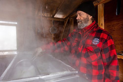 Dave Barnes mans the sap evaporator in his sugar shack at the Assiniboine Food Forest Saturday. (Chelsea Kemp/The Brandon Sun)