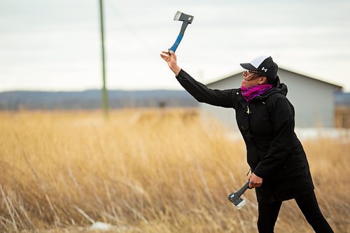 Desiree Wasicuna competes in the women&#x573; hatchet throwing contest during the Wipazoka Wakpa Winter Culture Camp Saturday in Sioux Valley Dakota Nation. (Chelsea Kemp/The Brandon Sun)