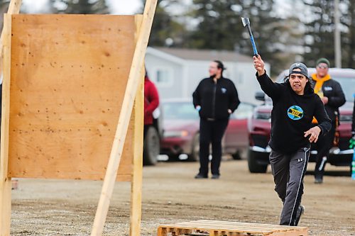 Jonathan Courchene competes in the mens&#x560;hatchet throwing contest during the Wipazoka Wakpa Winter Culture Camp Saturday in Sioux Valley Dakota Nation. (Chelsea Kemp/The Brandon Sun)