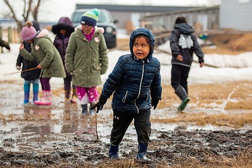 Youth play in the mud at the Wipazoka Wakpa Winter Culture Camp Saturday in Sioux Valley Dakota Nation. (Chelsea Kemp/The Brandon Sun)