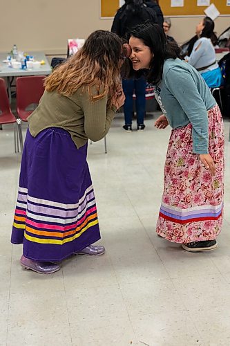 Elsa Roulette, 9, left, and Reina Lathlin, 10, compete in the potato dance at  Kahomani &#x482;ringing Communities Together&#x4e0;at the Mahkaday Ginew Memorial Centre Saturday. (Chelsea Kemp/The Brandon Sun)