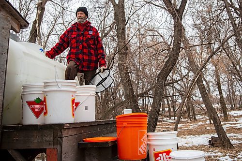 Dave Barnes loads his sap tank Saturday at the Assiniboine Food Forest. (Chelsea Kemp/The Brandon Sun)