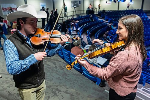 Melanie Smith and Grayson Ross prepare to judge the 47th Annual Royal Fiddlers&#x2019; Contest in the Manitoba Hydro Auditorium at the Keystone Centre during the Royal Manitoba Winter Fair Wednesday, (Chelsea Kemp/The Brandon Sun)