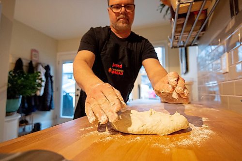 Mike Sudoma / Winnipeg Free Press
Bread maker, Jared Ozuk’s gets his hands dirty kneading a batch of dough in his kitchen Wednesday
April 5, 2022