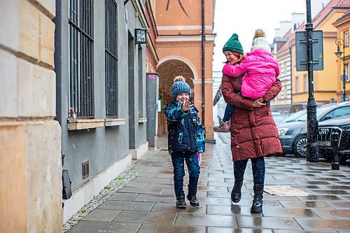 MIKAELA MACKENZIE / WINNIPEG FREE PRESS

Ilona Protynyak, and her children, Demian (five) and Milena (four), go for a walk through the old town in Warsaw on Friday, April 1, 2022. They have been going for long walks to entertain the children, and to give them good memories from this difficult time, while waiting for the Canadian visa paperwork to come through.  For Melissa story.
Winnipeg Free Press 2022.