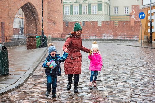 MIKAELA MACKENZIE / WINNIPEG FREE PRESS

Ilona Protynyak, and her children, Demian (five) and Milena (four), go for a walk through the old town in Warsaw on Friday, April 1, 2022. They have been going for long walks to entertain the children, and to give them good memories from this difficult time, while waiting for the Canadian visa paperwork to come through.  For Melissa story.
Winnipeg Free Press 2022.