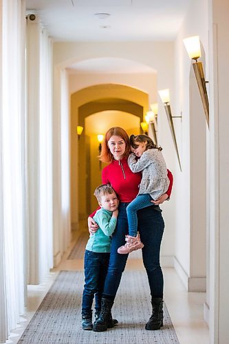 MIKAELA MACKENZIE / WINNIPEG FREE PRESS

Ilona Protynyak, and her children, Demian (five) and Milena (four), pose for a photo in a hallway in their hotel in Warsaw on Friday, April 1, 2022. They're stuck in Warsaw while waiting for the Canadian visa paperwork to come through.  For Melissa story.
Winnipeg Free Press 2022.