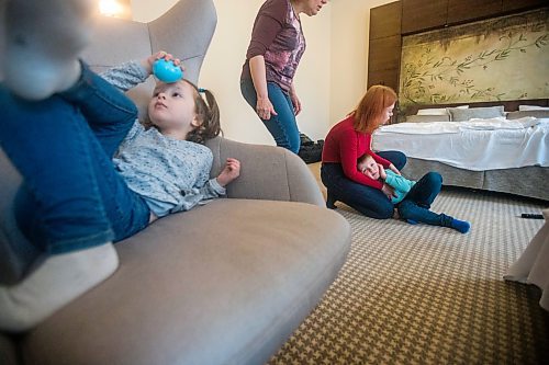 MIKAELA MACKENZIE / WINNIPEG FREE PRESS

Ilona Protynyak and her children, Demian (five) and Milena (four), and mother, Iryna Kuchynska, pass time in their hotel room in Warsaw on Friday, April 1, 2022. She has been trying to give the children good memories from this difficult time while waiting for the Canadian visa paperwork to come through.  For Melissa story.
Winnipeg Free Press 2022.