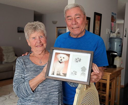 JASON HALSTEAD / WINNIPEG FREE PRESS

Ken and Mary Butchart show off a photo and the dog tag's of their deceased pet Holly in their home on April 7, 2022. Bichon Fris&#xe9;-cockapoo mix was badly mauled in 2018 by a dog they believe to have been a pitfull.
Re: Malak Abas story