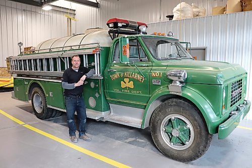Deputy fire chief Sean Phillips poses for a photo next to a modified 1967 GMC 960 truck on Wednesday evening. The vehicle has been a part of the Killarney-Turtle Mountain Fire Department&#x2019;s fleet for over 50 years and is facing retirement in the not-too-distant future. (Kyle Darbyson/The Brandon Sun)