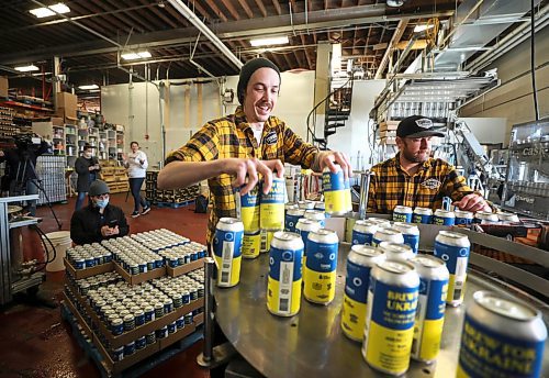 RUTH BONNEVILLE / WINNIPEG FREE PRESS

ENT - beer for Ukraine

Matthew Wolff (cap), Operations Manager at Torque Brewing, along with Kyle Maskiiw canning operator, are thrilled to start production of Ukraine Brew Friday.. Three thousand cans of the unique recipe will be produced with proceeds going to the Ukraine Crisis.  

Subject: Eight local craft breweries in Winnipeg are collaborating on a beer, with all proceeds going to a humanitarian relief fund in Ukraine. The beer recipe is from Pravda Brewing, a Ukrainian brewery based in Lviv.

The breweries collaborating are: Torque Brewing, Trans Canada Brewing, Nonsuch Brewing, Barn Hammer Brewing, One Great City Brewing, Devil May Care Brewing, Lake of the Woods Brewing, and Stone Angel Brewing.

Eva Wasney



April 8th,  2022
