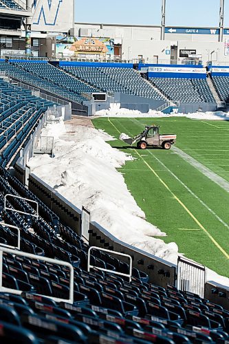 Mike Sudoma / Winnipeg Free Press
A front end loader removes snow from the sidelines of the field at Investors Group Field Friday morning.
April 8, 2022