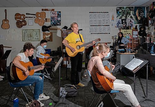 JESSICA LEE / WINNIPEG FREE PRESS

Ric Schulz (in yellow) is a long-time guitar teacher and champion for expanding music education across Manitoba schools. He is photographed in his classroom at Dakota Collegiate during class on June 3, 2022.

Reporter: Maggie Macintosh



