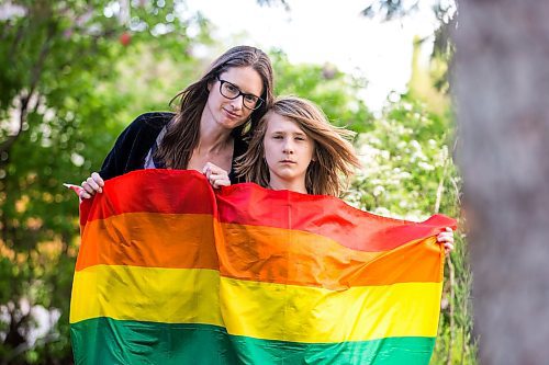 MIKAELA MACKENZIE / WINNIPEG FREE PRESS

Jennaya Isaac and her Grade 5 son, Kaiden Isaac, pose for a photo at their home in Winnipeg on Friday, June 3, 2022. Jennaya is demanding Calvin Christian fire its principal after he called out her son for bringing a Pride flag to school and being open about the fact he&#x2019;s gay. An incident on the playground, during which Kaiden was playing with a Pride flag he received for his birthday, and the school&#x2019;s mishandling of the situation has prompted the mother to file a human rights complaint. For Maggie story.
Winnipeg Free Press 2022.