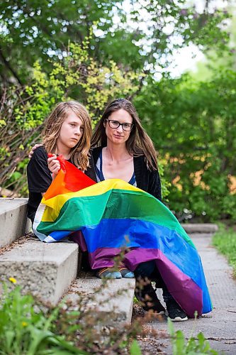 MIKAELA MACKENZIE / WINNIPEG FREE PRESS

Jennaya Isaac and her Grade 5 son, Kaiden Isaac, pose for a photo at their home in Winnipeg on Friday, June 3, 2022. Jennaya is demanding Calvin Christian fire its principal after he called out her son for bringing a Pride flag to school and being open about the fact he&#x2019;s gay. An incident on the playground, during which Kaiden was playing with a Pride flag he received for his birthday, and the school&#x2019;s mishandling of the situation has prompted the mother to file a human rights complaint. For Maggie story.
Winnipeg Free Press 2022.