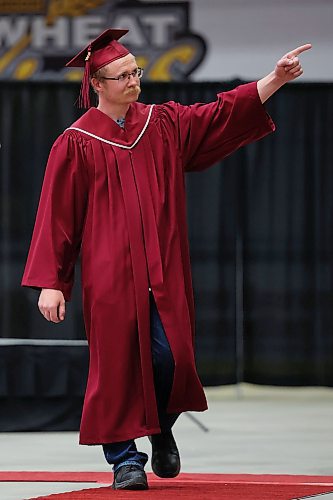 03062022
Civil Technology: Municipal Engineering Diploma graduate Leslie Skead points to the crowd while walking up to receive his diploma during Assiniboine Community College&#x2019;s 2022 graduation ceremony at Westoba Place on Friday. 
(Tim Smith/The Brandon Sun)