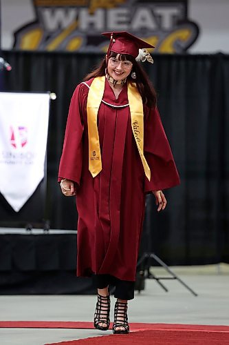 03062022
Valedictorian and Social Service Worker Diploma graduate Alexis Cinq-Mars smiles while walking to receive her diploma during Assiniboine Community College&#x2019;s 2022 graduation ceremony at Westoba Place on Friday. 
(Tim Smith/The Brandon Sun)