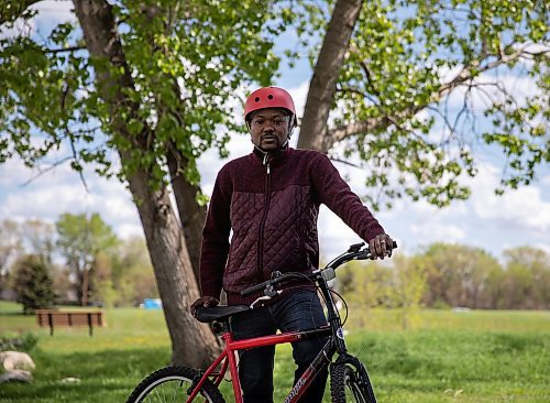 JESSICA LEE / WINNIPEG FREE PRESS

Jubril Adeyemoh from Nigeria, poses with his bike on June 3, 2022. He says WRENCH&#x2019;s adult learn to ride program has changed his life and he can now ride with his two young kids.

Reporter: Malak Abas



