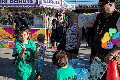 JESSICA LEE / WINNIPEG FREE PRESS

Hudson Antonchuk, 8, and his brother Caiden, 5, attend Transcona Hi Neighbour Festival on June 3, 2022 after a two year hiatus because of the pandemic.





