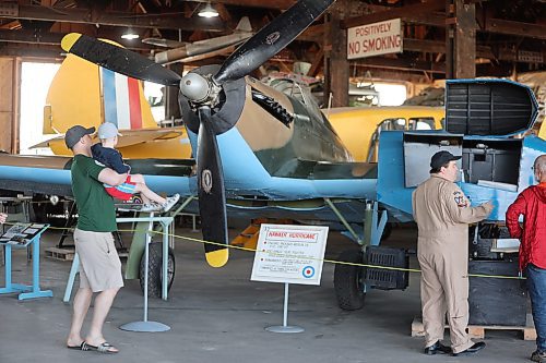 A visiting family checks out the Hawker Hurricane fighter plane that was on display at the Commonwealth Air Training Plan Museum on Sunday. (Kyle Darbyson/The Brandon Sun)