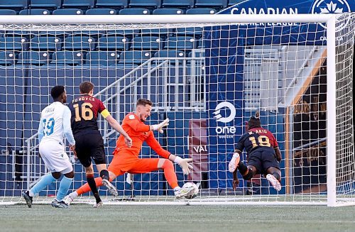 JOHN WOODS / WINNIPEG FREE PRESS
Valour FC William Akio (19) scores on FC Edmonton Andreas Raido Karuks Vaikla (1) during extra time in Winnipeg Sunday, June 5, 2022. 

Re: gavin