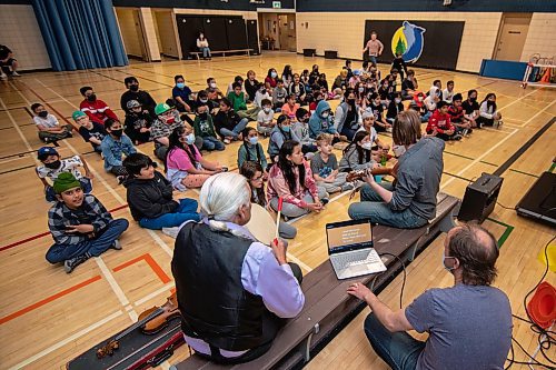 ETHAN CAIRNS / WINNIPEG FREE PRESS
Students of A. E. Wright School to rehearse a cree musical with Elder Winston who is beating a drum, and music teacher Jordan Laidlaw playing guitar in the gymnasium midday in Winnipeg, Manitoba on Monday June 6, 2022. 